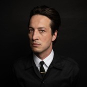 Marlon Williams in a black suit
